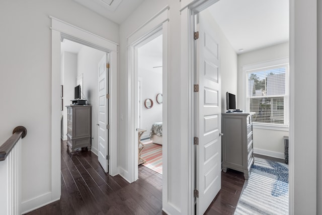 hallway with dark hardwood / wood-style flooring