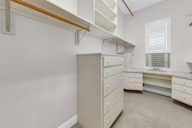 walk in closet featuring sink