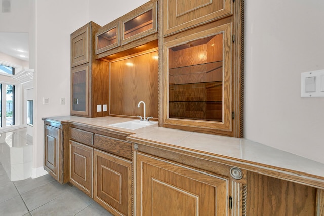 kitchen with sink and light tile patterned floors