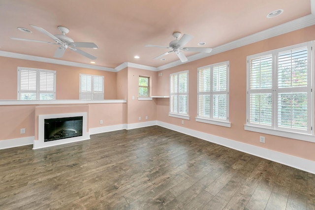 unfurnished living room featuring crown molding, ceiling fan, and dark hardwood / wood-style flooring