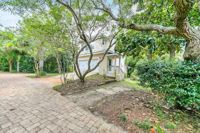 view of side of property featuring a garage