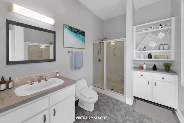 bathroom featuring vanity, toilet, tile patterned flooring, and a shower with door