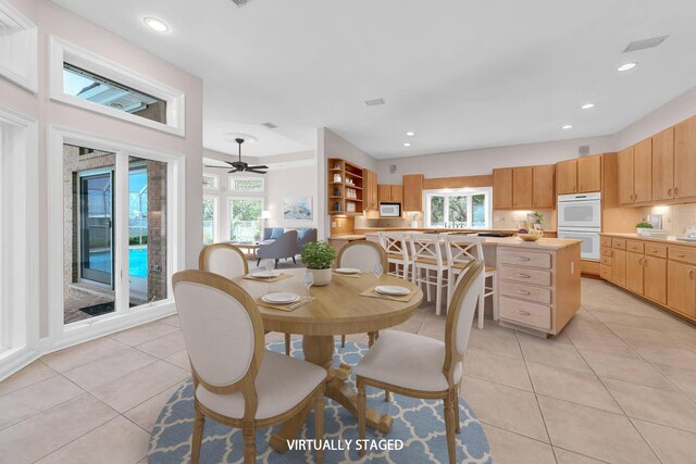 tiled dining area with a wealth of natural light