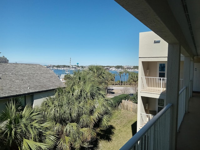 balcony featuring a water view