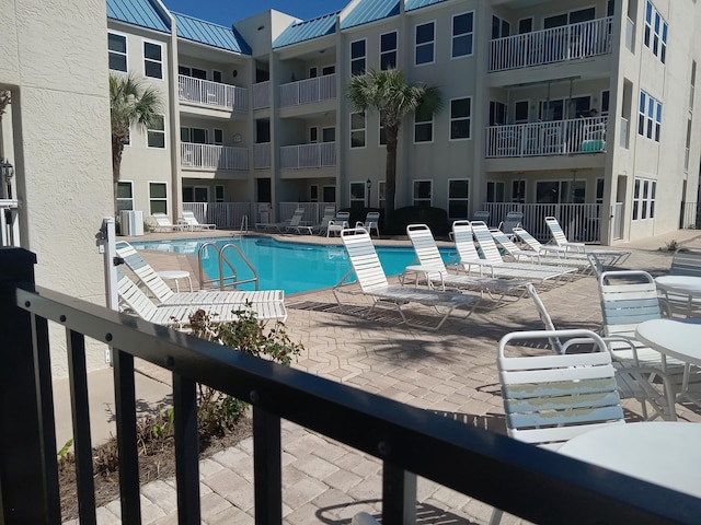 view of pool featuring a patio