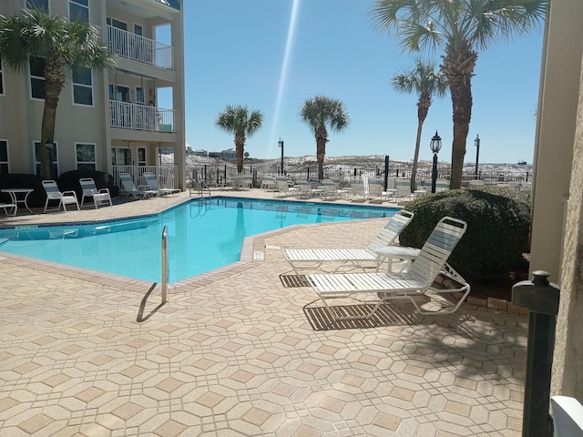 view of swimming pool with a patio