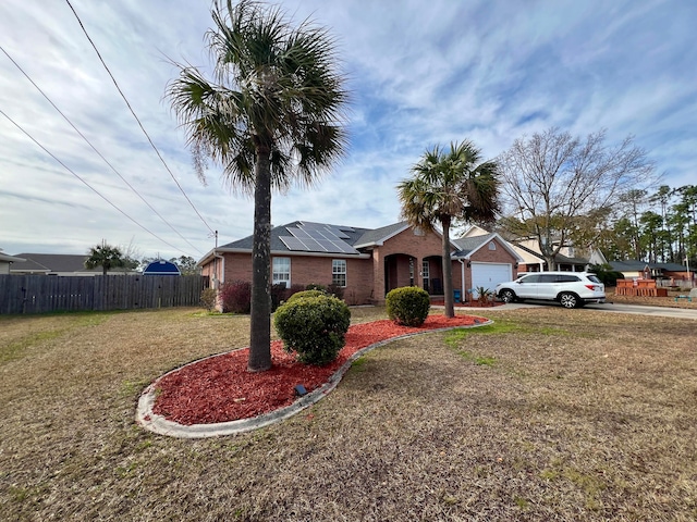 ranch-style house featuring a front lawn