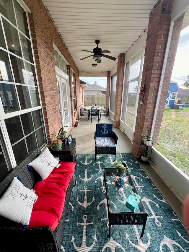 sunroom / solarium with ceiling fan