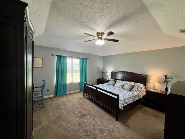 bedroom featuring light carpet, ceiling fan, lofted ceiling, and a textured ceiling