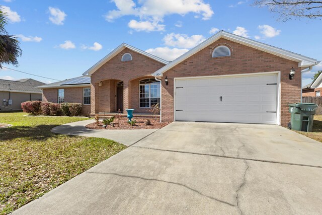 ranch-style home featuring a front yard and a garage