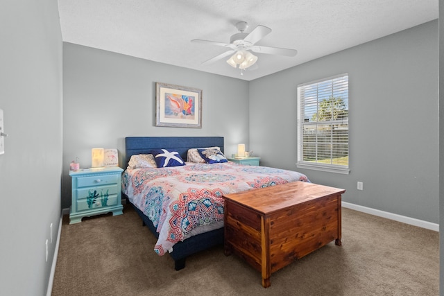 bedroom featuring carpet, a textured ceiling, and ceiling fan