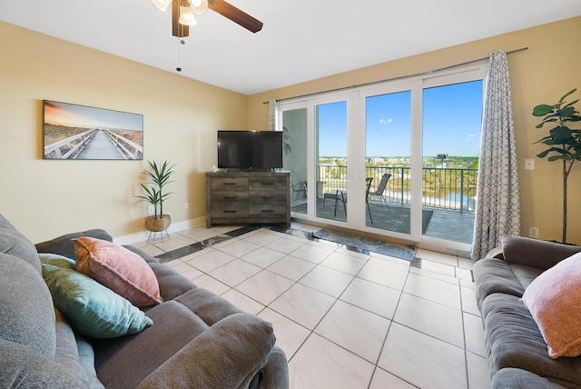 living room featuring ceiling fan and light tile floors