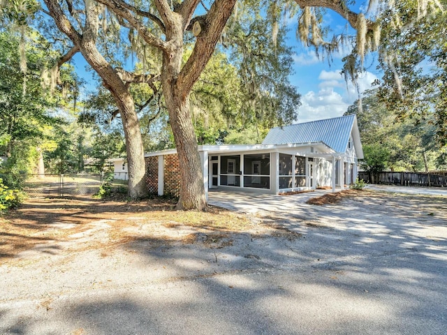 view of side of property with a sunroom