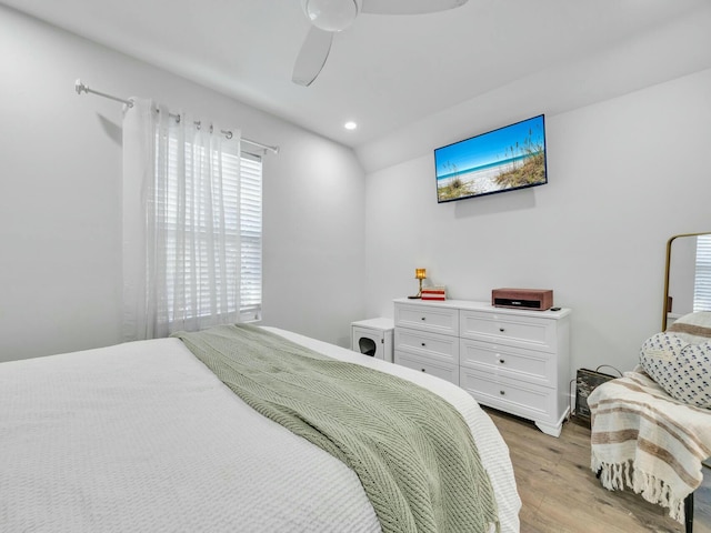 bedroom featuring ceiling fan and light hardwood / wood-style flooring