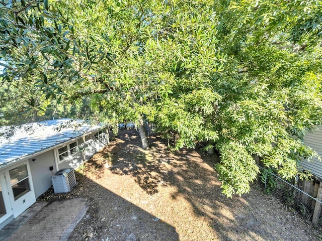 view of yard with central AC unit