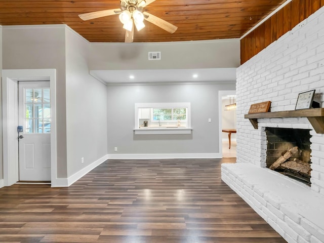 living room with a fireplace, dark hardwood / wood-style flooring, ornamental molding, and wood ceiling