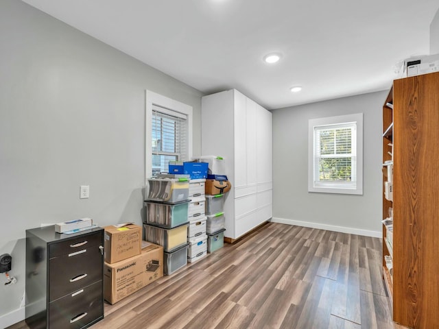 home office with hardwood / wood-style flooring