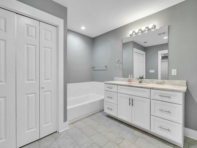 bathroom with vanity and a bathtub