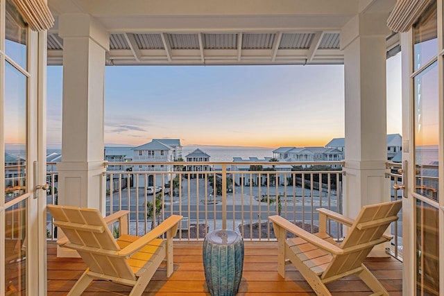 balcony at dusk with a water view