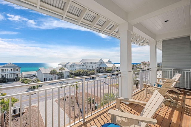 balcony featuring a water view