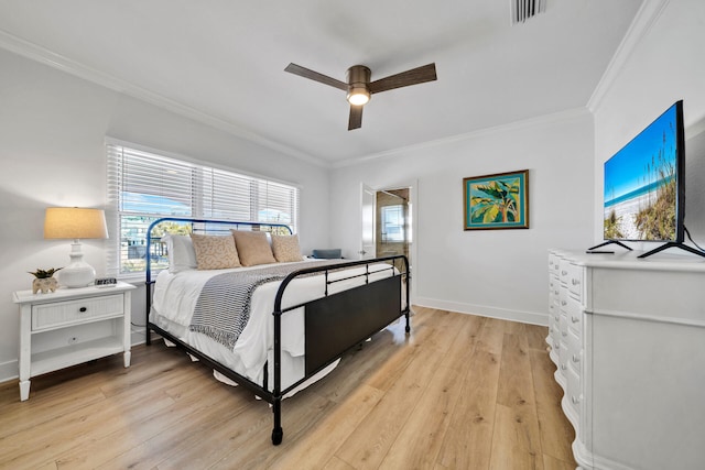 bedroom with ceiling fan, light hardwood / wood-style floors, and ornamental molding