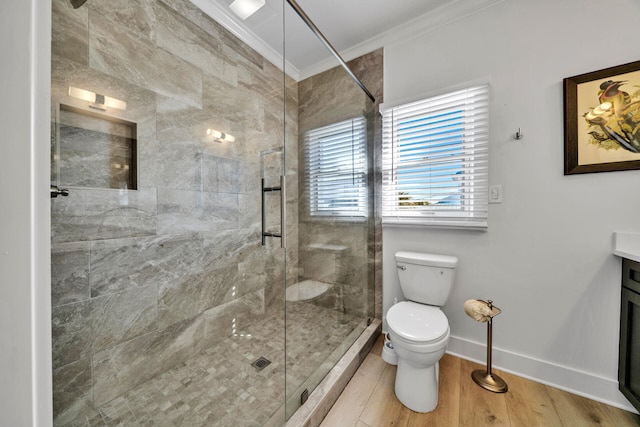 bathroom with an enclosed shower, crown molding, vanity, hardwood / wood-style floors, and toilet