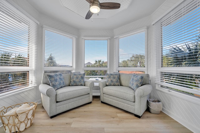 sunroom / solarium with a wealth of natural light and ceiling fan