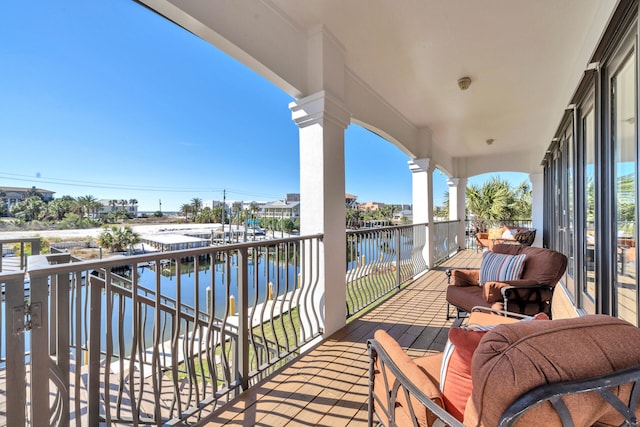 balcony featuring a water view