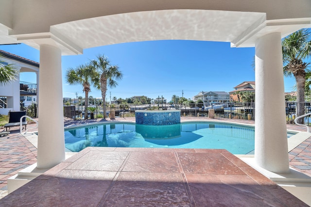 view of swimming pool featuring a patio area