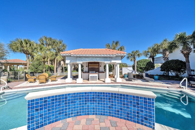 view of pool featuring a patio area, a gazebo, and area for grilling