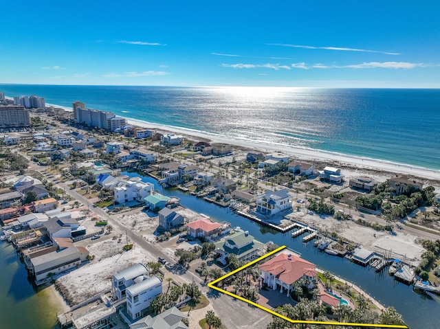 bird's eye view featuring a water view and a view of the beach