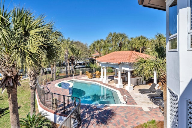 view of swimming pool with a patio