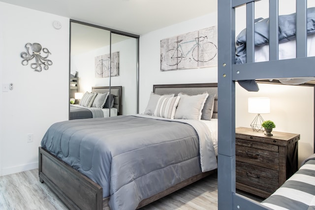 bedroom with a closet and light wood-type flooring