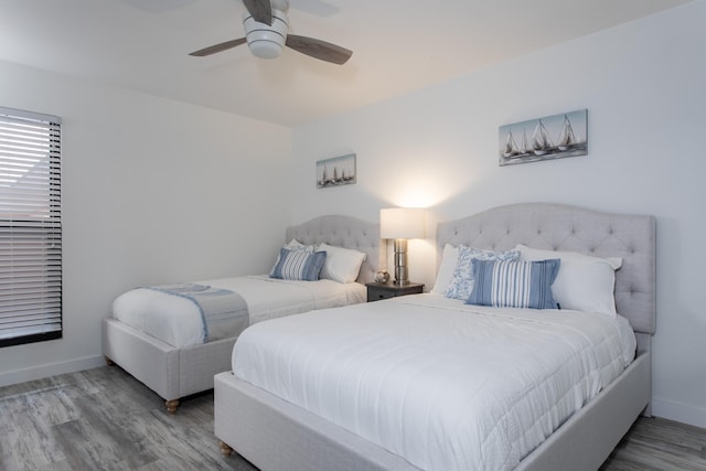 bedroom featuring hardwood / wood-style floors and ceiling fan