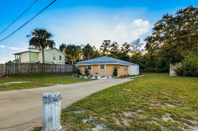 rear view of house with a yard