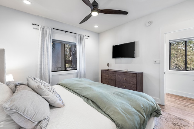 bedroom featuring light hardwood / wood-style flooring and ceiling fan