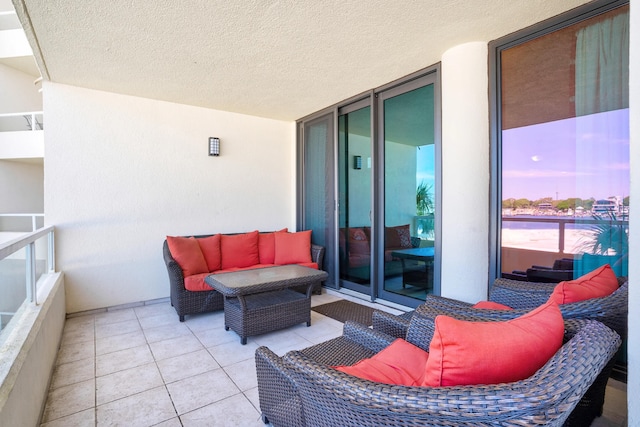 balcony at dusk featuring an outdoor hangout area