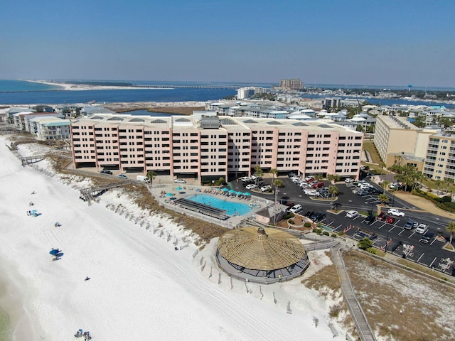 birds eye view of property with a water view and a city view