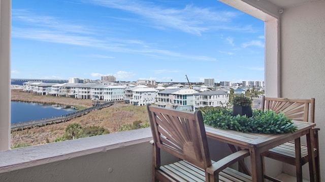 balcony featuring a water view