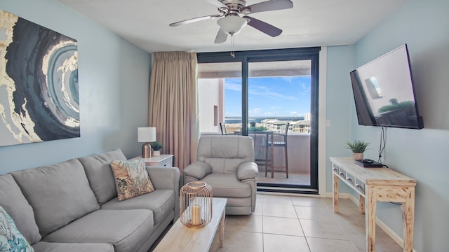 living room with light tile patterned floors and ceiling fan