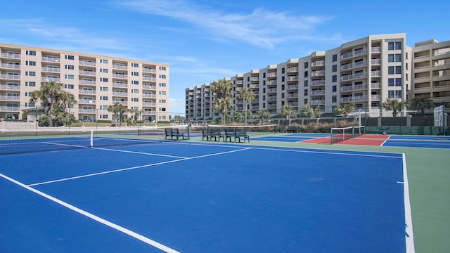 view of sport court featuring fence