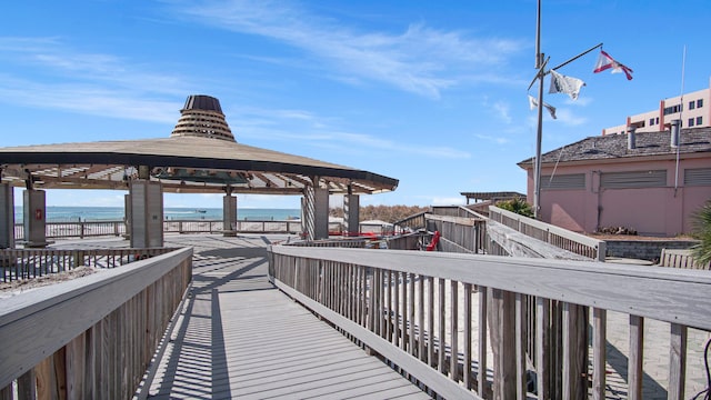 view of home's community with a gazebo and a water view