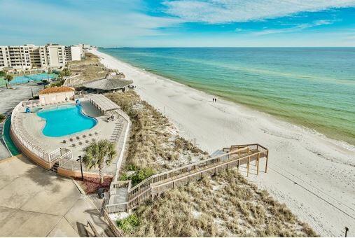 bird's eye view featuring a view of the beach and a water view