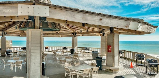 view of patio / terrace featuring grilling area, a gazebo, outdoor dining area, and a water view