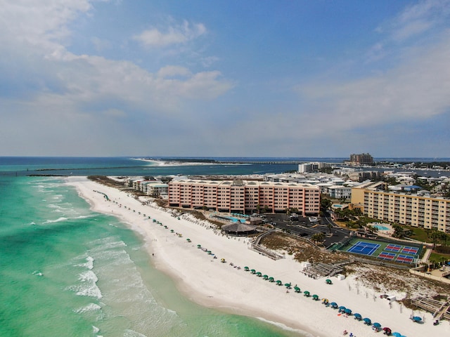 birds eye view of property featuring a water view, a view of city, and a beach view