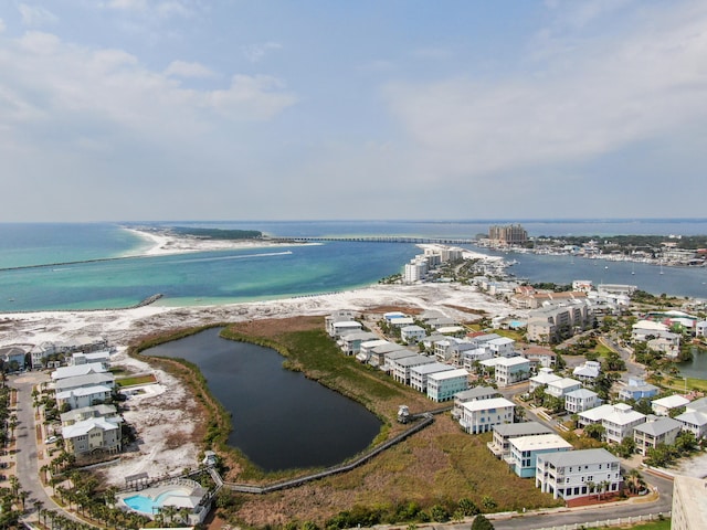 drone / aerial view featuring a water view and a beach view