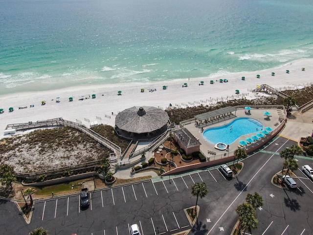 bird's eye view with a water view and a view of the beach