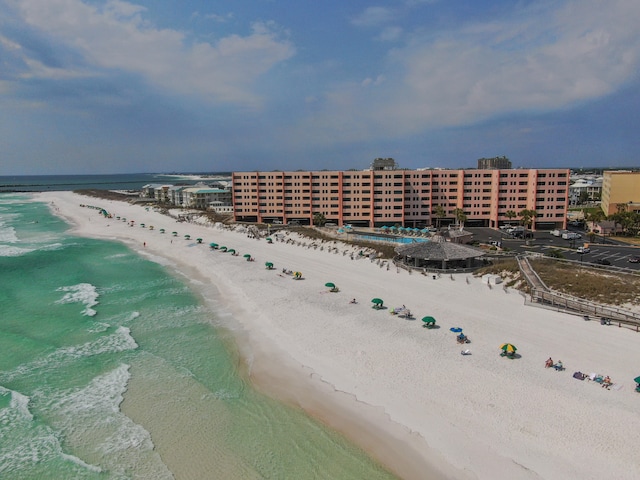 bird's eye view with a water view and a view of the beach