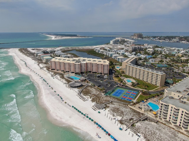 aerial view featuring a view of the beach, a water view, and a city view