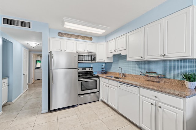 kitchen with white cabinetry, visible vents, appliances with stainless steel finishes, and a sink